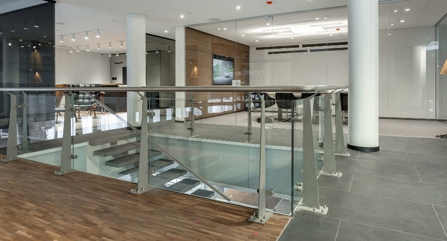 Multi-level commercial foyer Upper Ferntree Gully - glass balustrade staircase, timber feature wall, LED downlights and mixed flooring
